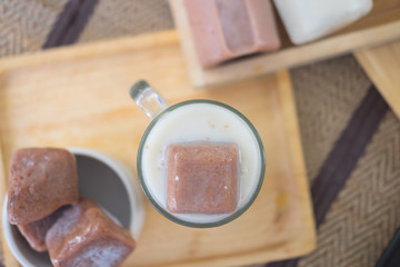 Frozen chocolate in a glass with milk