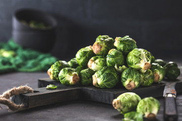 Fresh raw brussels sprouts on a wooden table