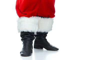 cropped view of santa claus posing in boots isolated on white © LIGHTFIELD STUDIOS