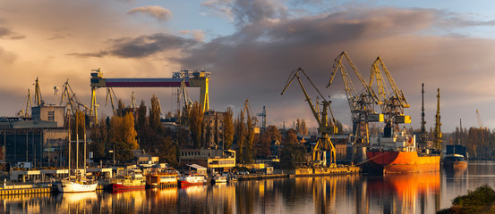 Szczecin, Poland-November 2018: A view of the repair shipyard and the quay in Szczecin - obrazy, fototapety, plakaty