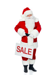 santa claus holding board with red sale sign isolated on white