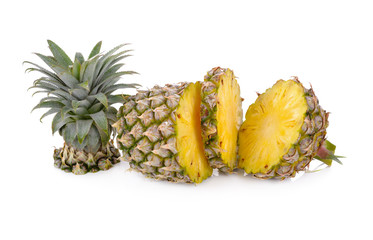 cut and sliced fresh pineapple on white background