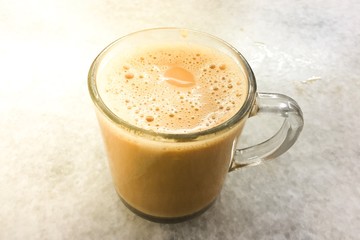 top view of milk tea on the cup. selective focus.Image bLur and Noise available when view at full resolution.