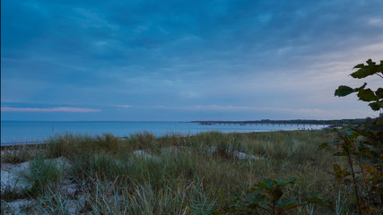Obraz na płótnie Canvas sunset nature scene baltic sea strand an der ostsee bei boltenhagen in germany nach sonnenuntergang