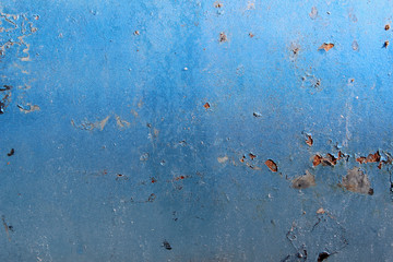 Rusty corroded blue painted metal surface close up detail