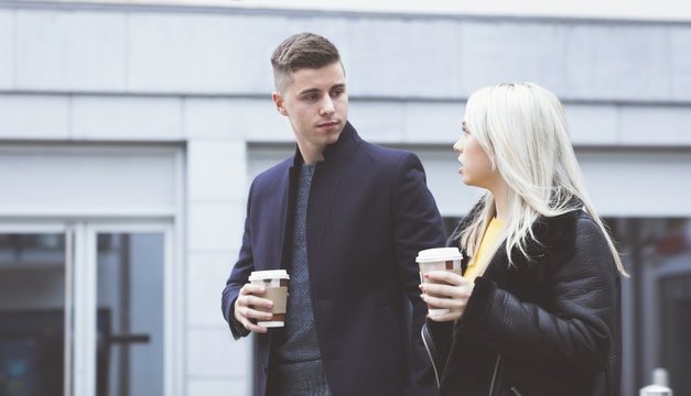 Couple interacting while having coffee