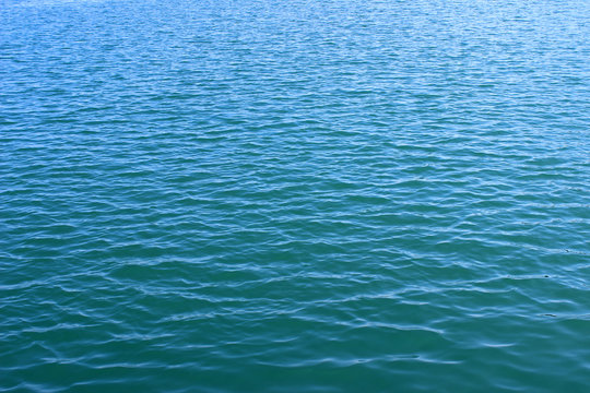 Blue clean sea water surface texture horizontal ripples background wallpaper