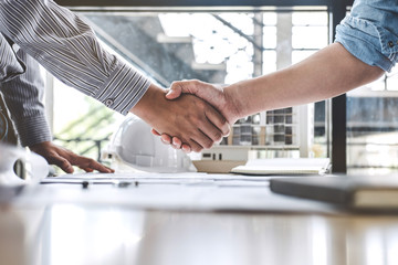 Meeting and greeting, Two engineer or architect meeting for project, handshake after consultation and conference new project plan, contract for both companies, success, partnership