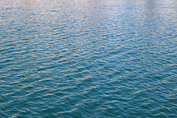 Blue sea water surface texture color reflection summer abstract wallpaper background detail