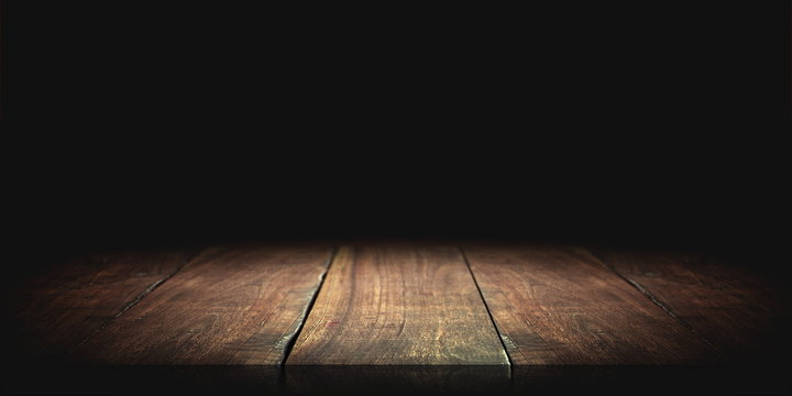Wood table in the dark background.
