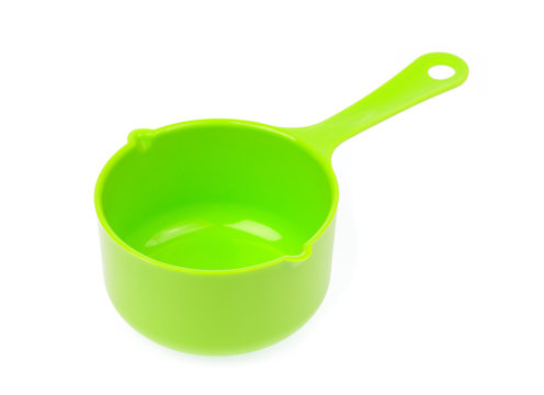 green plastic scoop isolated on white background