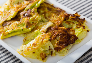 Image of vegetarian dish  of leaves of cabbage  in batter