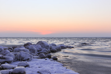 beautiful winter seascape with frozen rocks