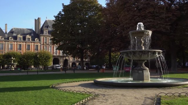 PARIS, FRANCE - OCTOBER 05: fountain flowing at Place de Vosges, Paris, France