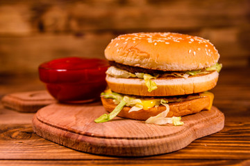 Hamburger and sauce on a wooden table