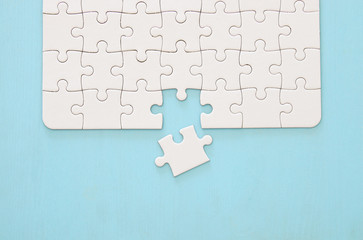 background of white puzzle with missing piece.