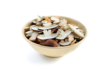 bay bolete mushrooms in a bowl. isolated white background.