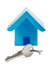 Estate concept, house and key on isolated white background with shadow. Idea for real estate concept, personal property and family house.