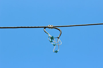 Inadequate unfitting connected connection electrical wires tape isolated composition detail blue sky 