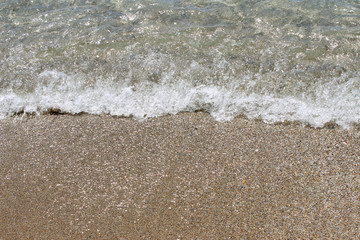 Fototapeta na wymiar Sea water beach swash