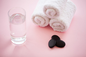 Spa. White Cotton Towels Use In Spa Bathroom on Pink Background. Towel Concept. Photo For Hotels and Massage Parlors. Purity and Softness. Towel Textile