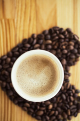 Good Morning. Coffee To Go. Coffee Cups With Cover and Coffee Beans on Wooden Table Backound