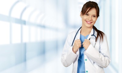 Attractive female doctor  on background
