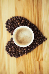 Good Morning. Coffee To Go. Coffee Cups With Cover and Coffee Beans on Wooden Table Backound