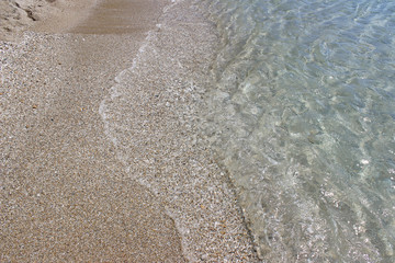Sea water sandy beach swash shallow wave 