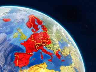 Schengen Area members from space on realistic model of planet Earth with country borders and detailed planet surface and clouds.