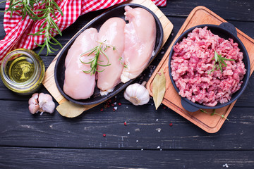 Raw uncooked chicken  breasts and minced meat