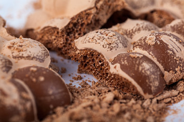 Broken milky porous chocolate, sweets and desserts