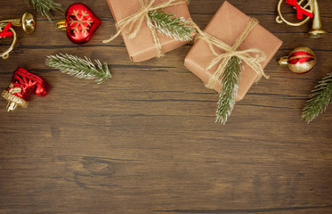 Flat lay,top view Christmas ornaments and gift boxes on wooden background with copy space 