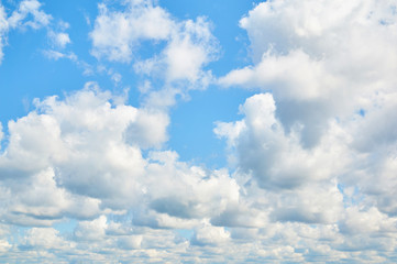 Porous clouds in the blue sky. Nature background.