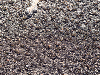 frozen surface of asphalt road close up
