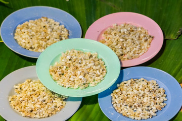 Close up of Ant eggs on banana leaf for sold in the market.