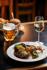 american hamburger with glass of beer of wine in american restaurant, product photography for restaurant in american style