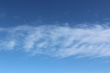 White clouds blue sky noon sun horizontal gradient trace formation composition moving fast