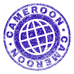 CAMEROON stamp print with grunge texture. Blue vector rubber seal print of CAMEROON label with grunge texture. Seal has words arranged by circle and planet symbol.