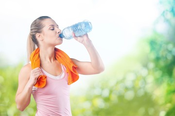 Young sporty women running and drink water