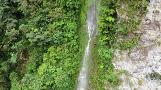 Aerial view of a beautiful waterfall in the Latin American jungle