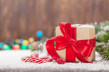 Christmas gift box, candy canes and tree