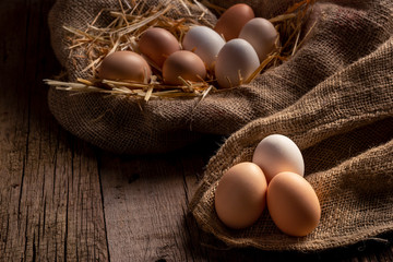 Fresh eggs on wooden dark table