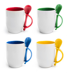 Set of colored cups with spoon isolated on a white background