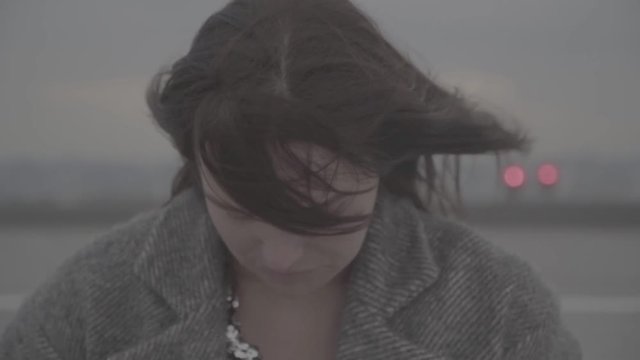 Cute girl turns her head from right to left. Slow motion, s-log, ungraded