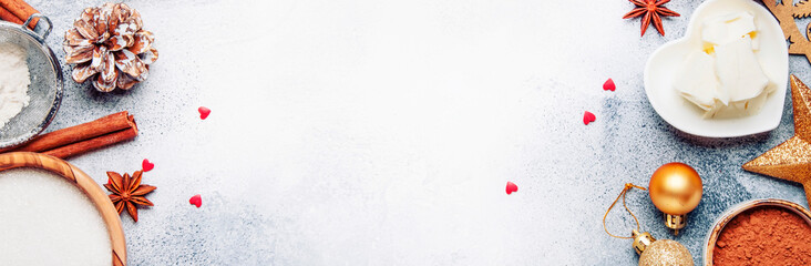 Christmas or New Year composition with ingredients for baking or cookies, with golden snowflakes, Christmas balls, on gray background, with inscription merry xmas, frame, banner, top view