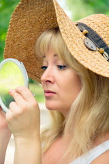 European blond woman in straw hat
