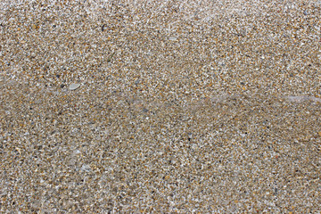 Shallow sea water beach sand pebbles