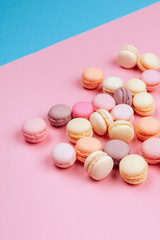 Cake macaron or macaroon on pink and blue background., flavor almond cookies, pastel colors, vintage card