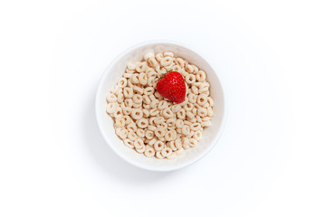 oat rings cereal with strawberry. bowl of cereal with berries on a white background. flat lay, top view